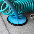 RV Water hose passing through an access port with a port cover.