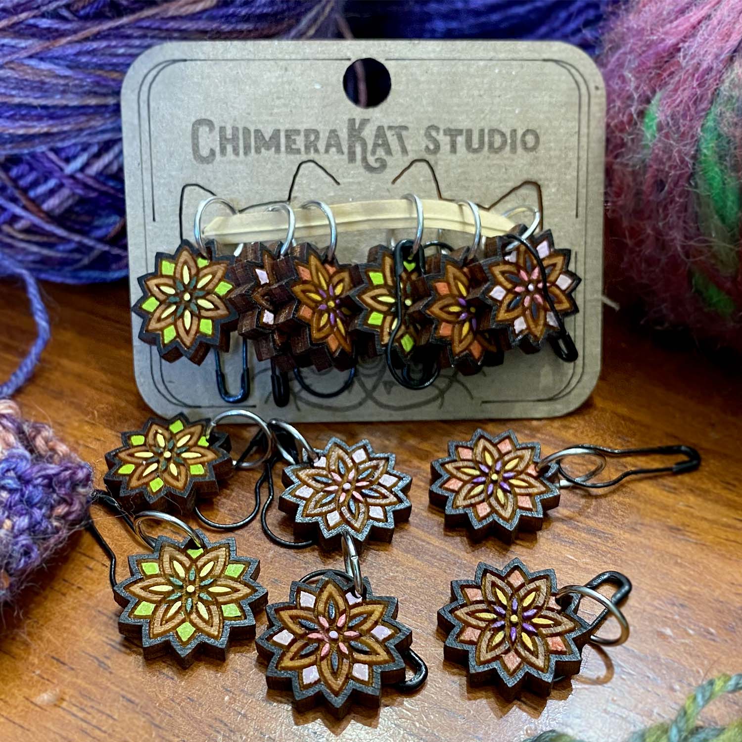 The Mandala hand painted stitch marker set from ChimeraKat Studio