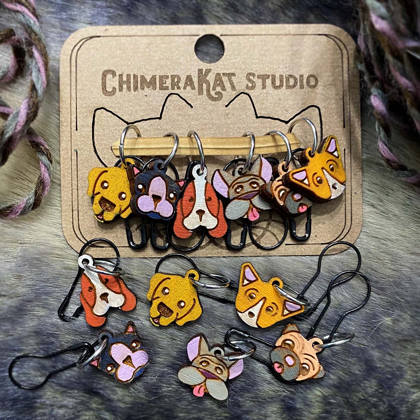 The Pupper hand painted stitch marker set from ChimeraKat Studio
