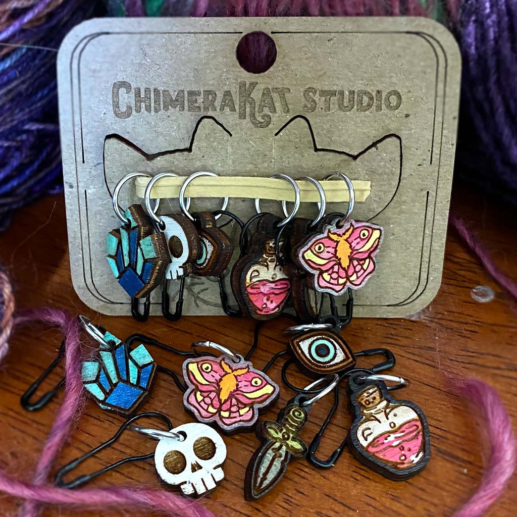 The Mystic hand painted stitch marker set from ChimeraKat Studio