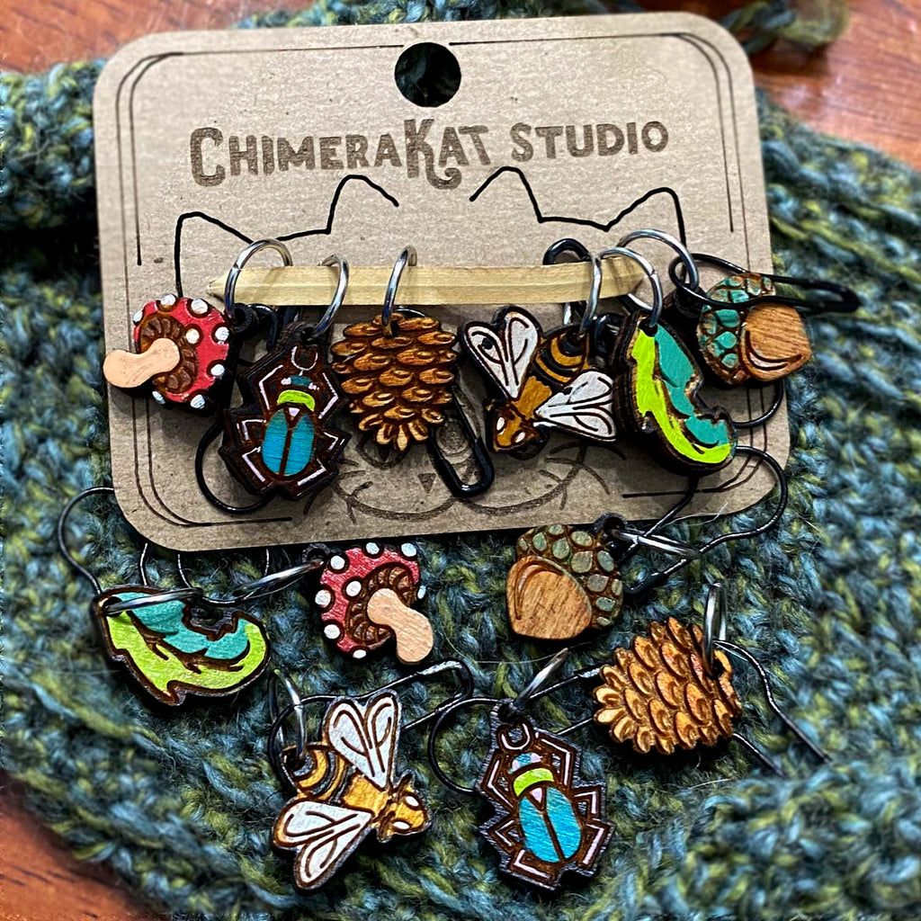 The Natural hand painted stitch marker set from ChimeraKat Studio