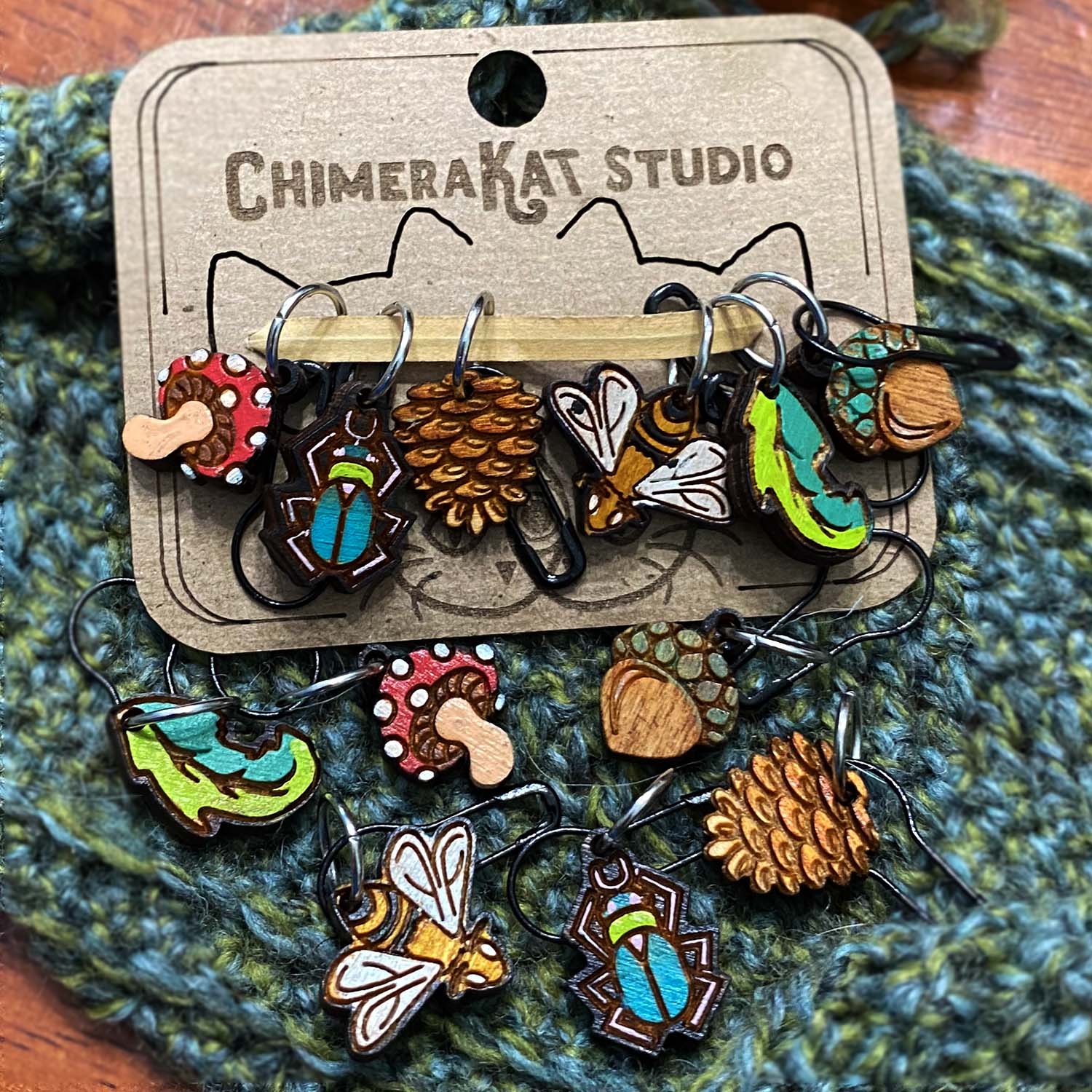 The Natural hand painted stitch marker set from ChimeraKat Studio